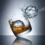 Focilabdát mintázó jéggömb whiskyspohárban, fröccsenő vízzel